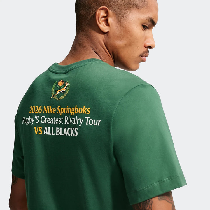 A man viewed from the back-right wearing a green 2026 Nike Springboks Rugby’S Greatest Rivalry Tour Men T-Shirt with short