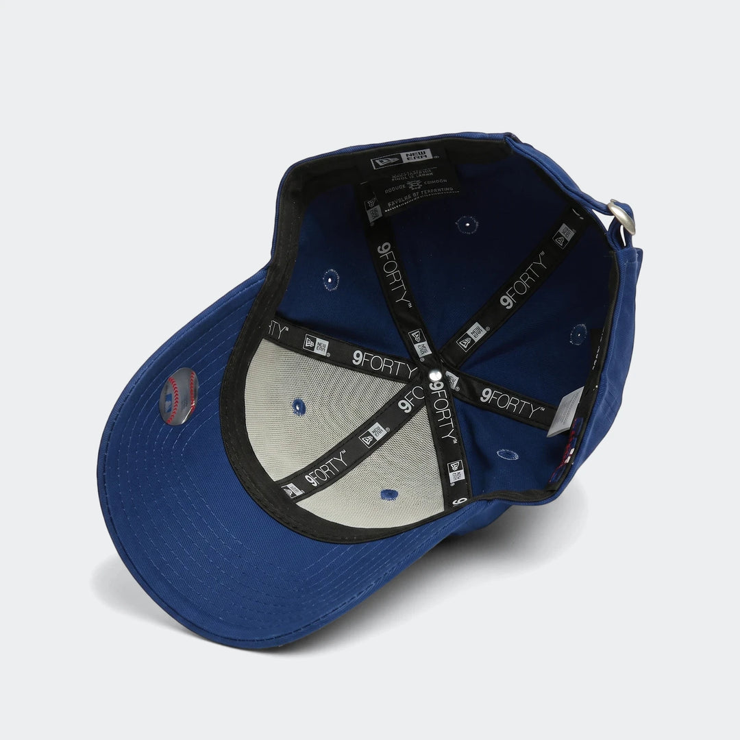 blue 940 Todd League Essential baseball cap, shown inside-out with visible interior branding and brim sticker.