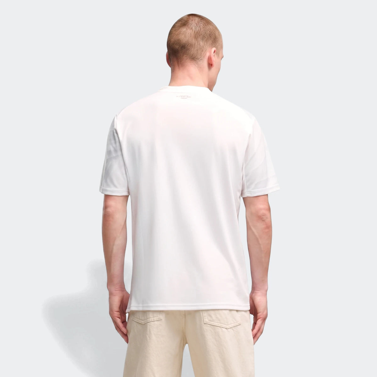 Men's Ac Milan 26/27 Away Jersey in white, short-sleeve, worn by a model and viewed from the back.