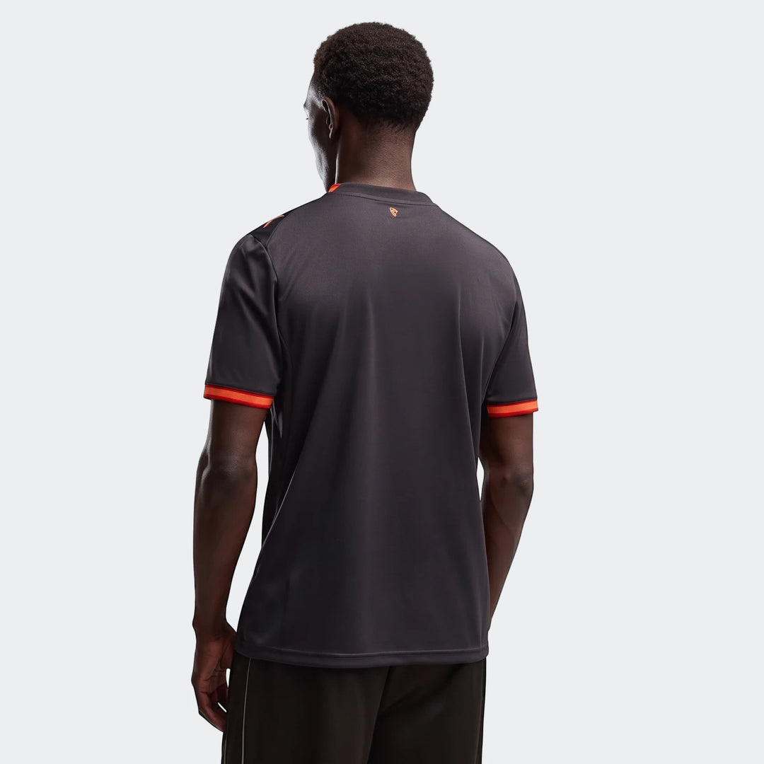Men's dark grey Ac Milan 26/27 Third Jersey with orange collar and sleeve cuff trim, shown from the back on a male model.