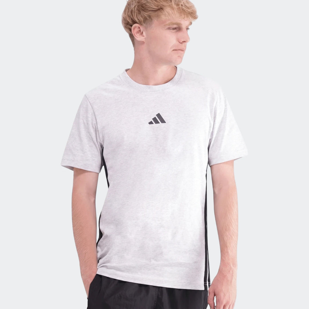 Male model wearing a light grey Adidas 3-Stripes Single Jersey T-Shirt, short sleeve, round neck, with black side stripes.