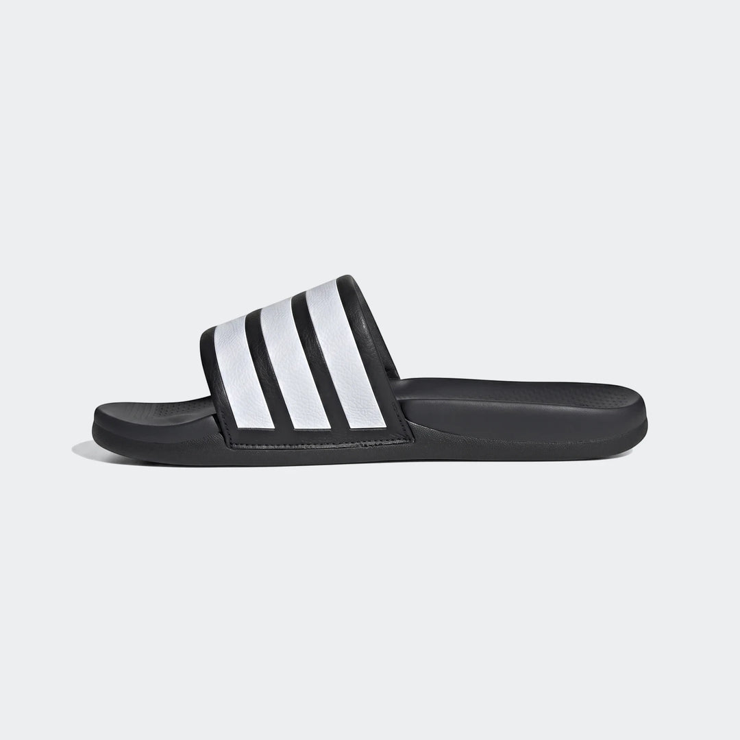 Adidas Adilette Comfort 2.0 Slides in black with white stripes, shown in a side view on a plain background.