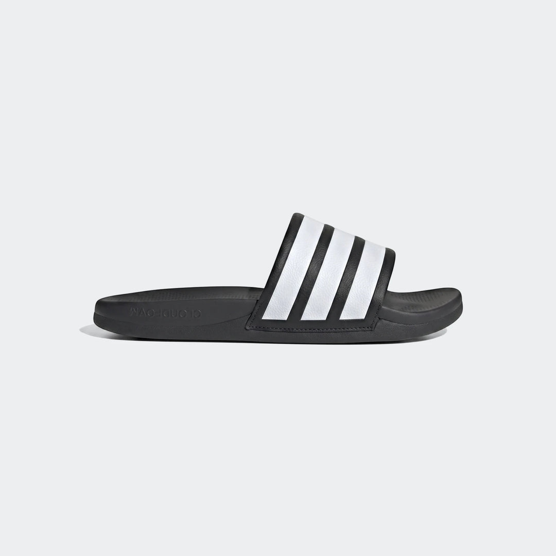 Black Adidas Adilette Comfort 2.0 slides featuring iconic white stripes, presented in a clear side view.
