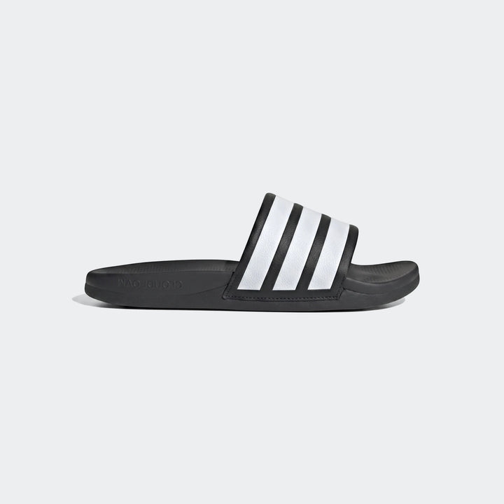 Black Adidas Adilette Comfort 2.0 slides featuring iconic white stripes, presented in a clear side view.