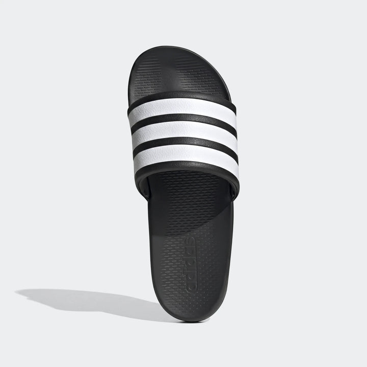 Black and white Adidas Adilette Comfort 2.0 slides with signature three stripes, viewed from above.