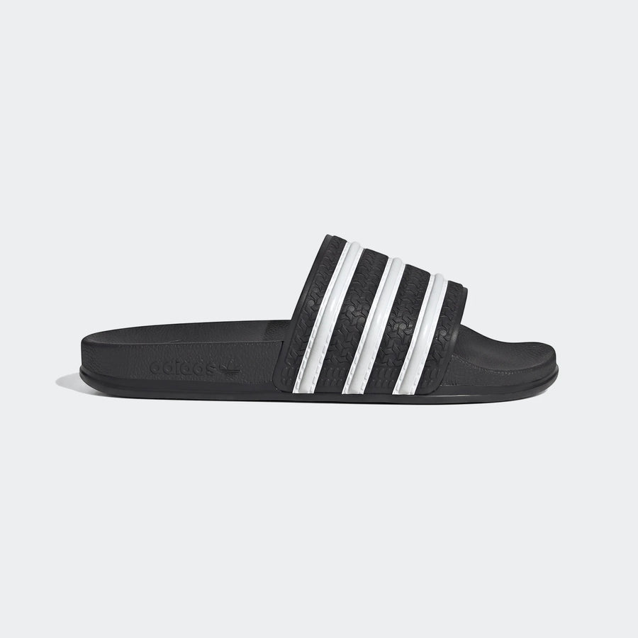 Black Adidas Adilette Og Cf Slides with white stripes, shown in a side profile view, suitable for casual wear.