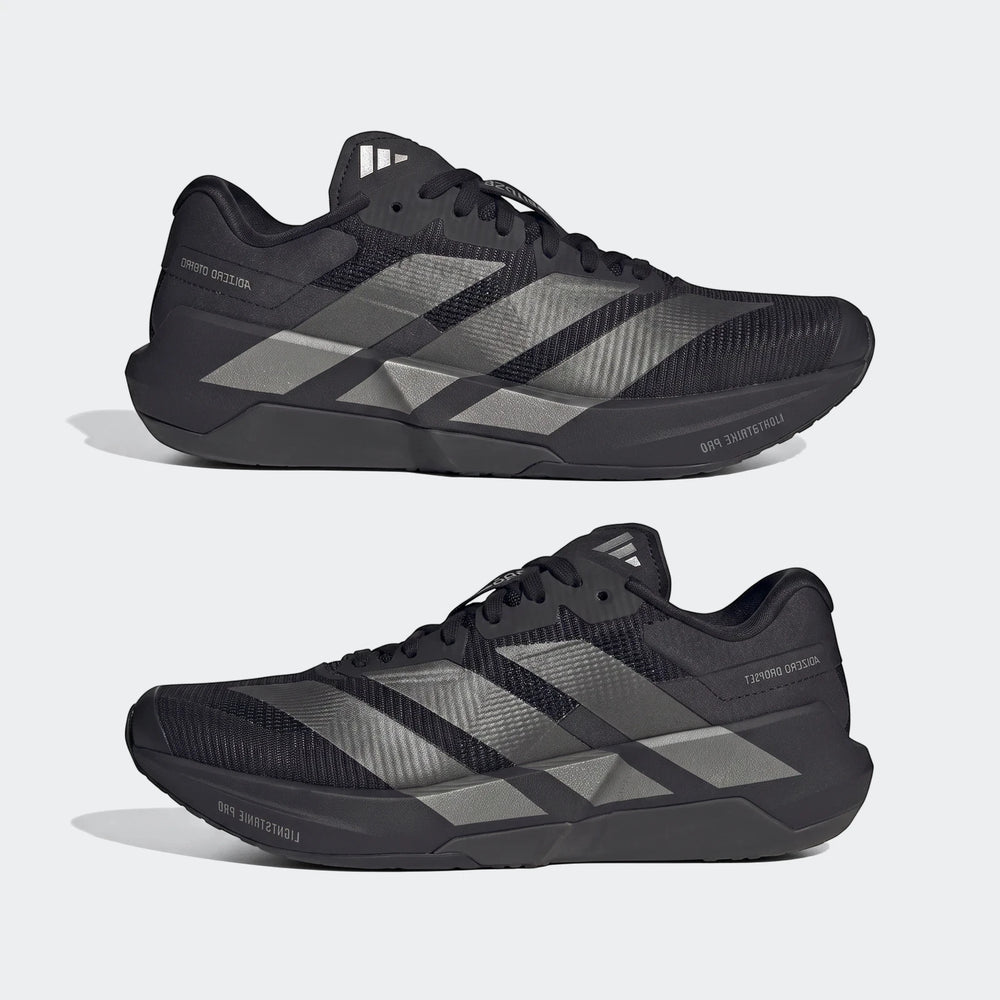 Two black Adidas Adizero Dropset Pro training shoes with silver three stripes on the side, displayed in a side-by-side view.