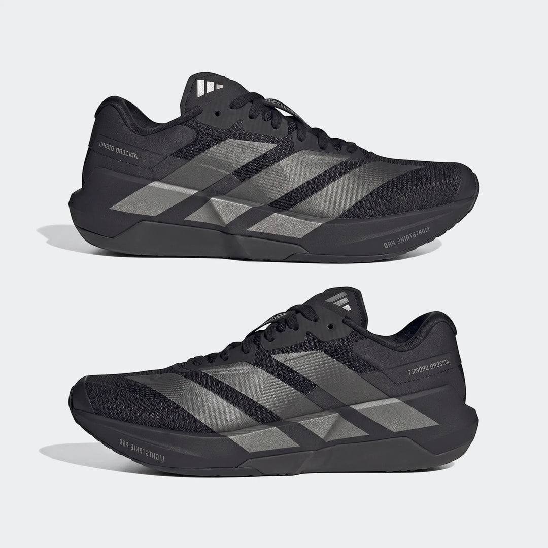 Two black Adidas Adizero Dropset Pro training shoes with silver three stripes on the side, displayed in a side-by-side view.