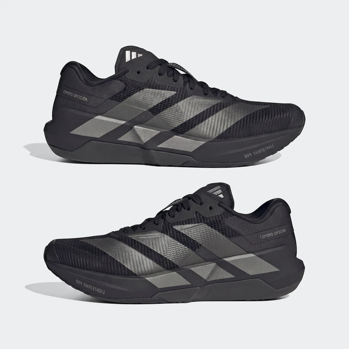 Two black Adidas Adizero Dropset Pro training shoes with silver three stripes on the side, displayed in a side-by-side view.