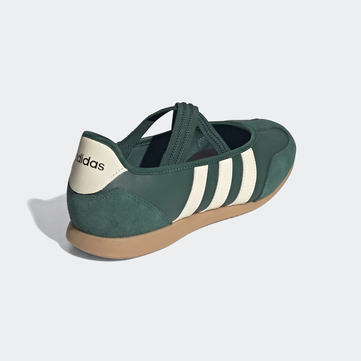 Adidas Barreda Mary Jane shoe in dark green with off-white stripes and a tan sole, viewed from the rear-right.