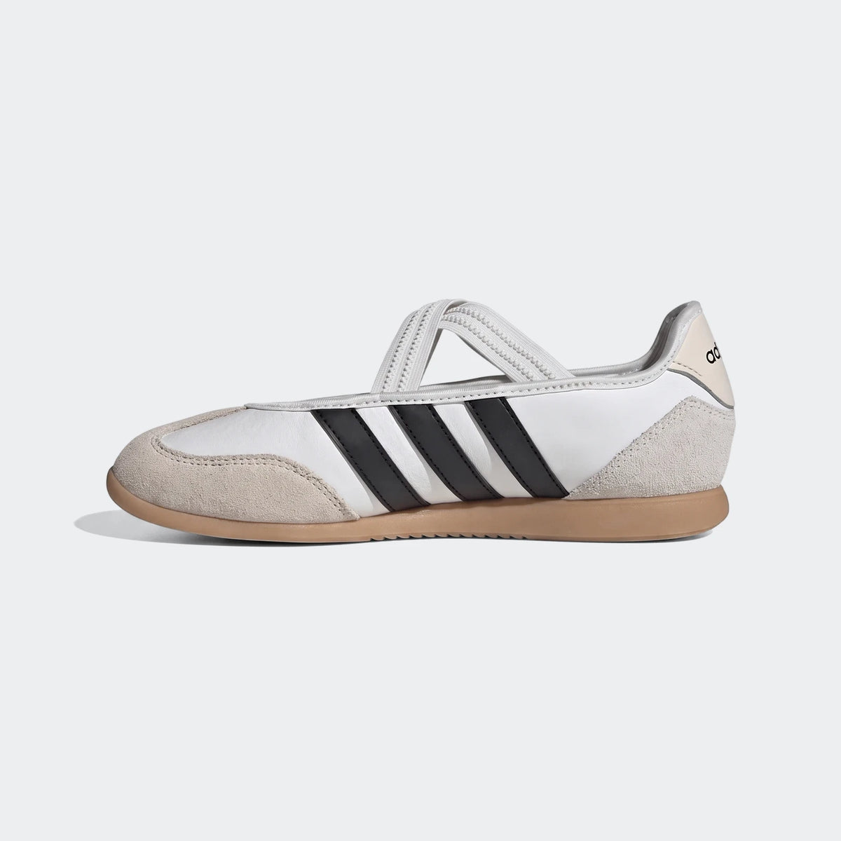 White Adidas Barreda Mary Jane shoes with black stripes, suede accents, and a gum sole, shown in a side profile.