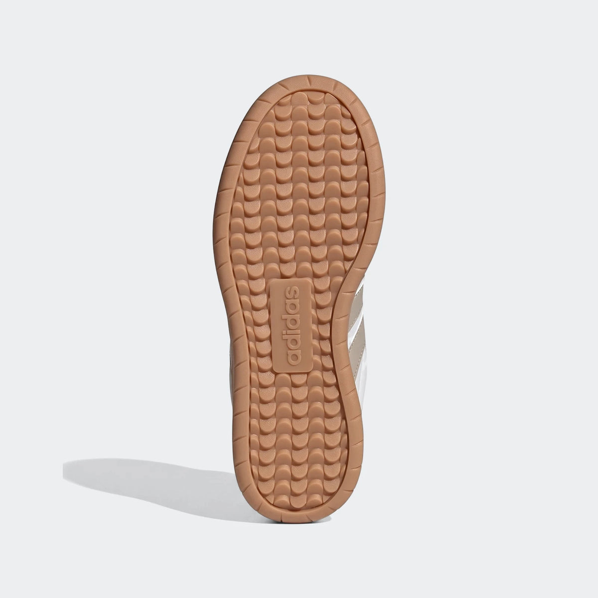 Bottom view of Adidas Barreda Shoes, showcasing the light brown gum sole with a textured tread pattern and the embossed