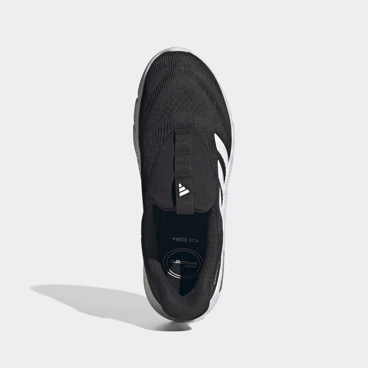 Black and white Adidas wide-fit slip-on running shoe with Cloudfoam comfort and mesh upper, top view.