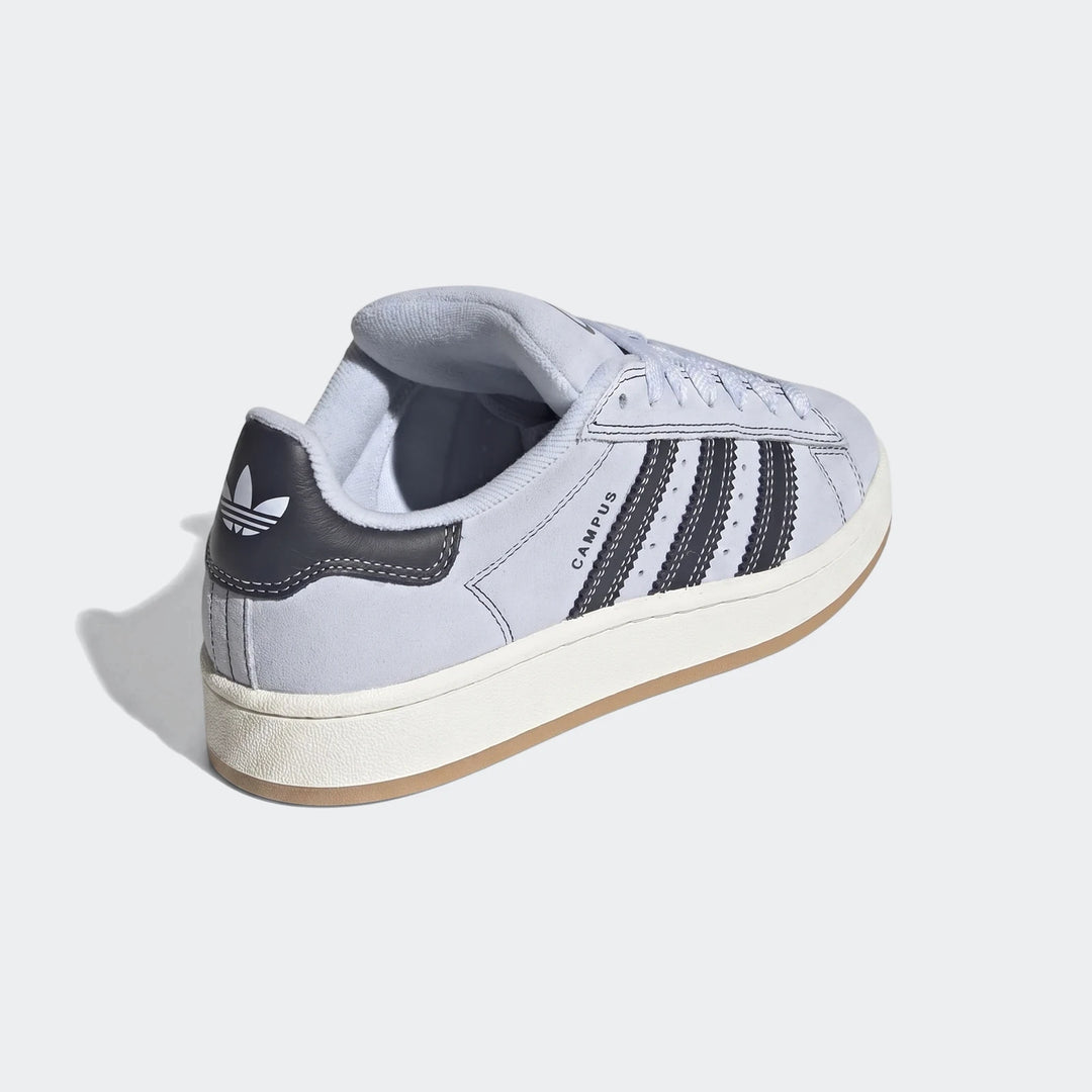 Adidas Campus 00S shoes in light blue suede with dark grey stripes and a white sole, viewed from a rear-quarter angle.