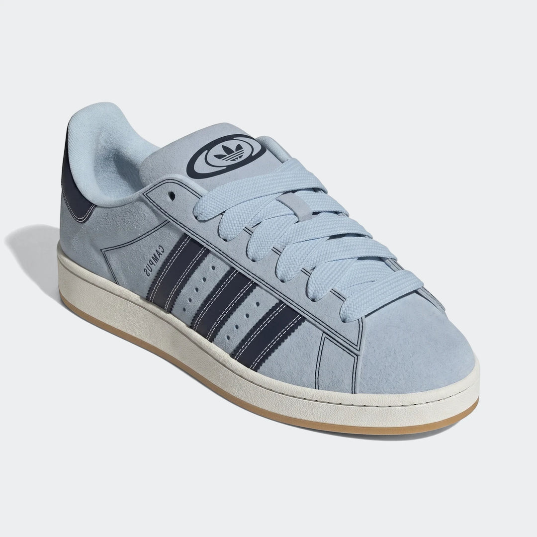 Adidas Campus 00S Shoes in light blue suede with navy stripes, a white midsole, and a gum outsole, viewed from a