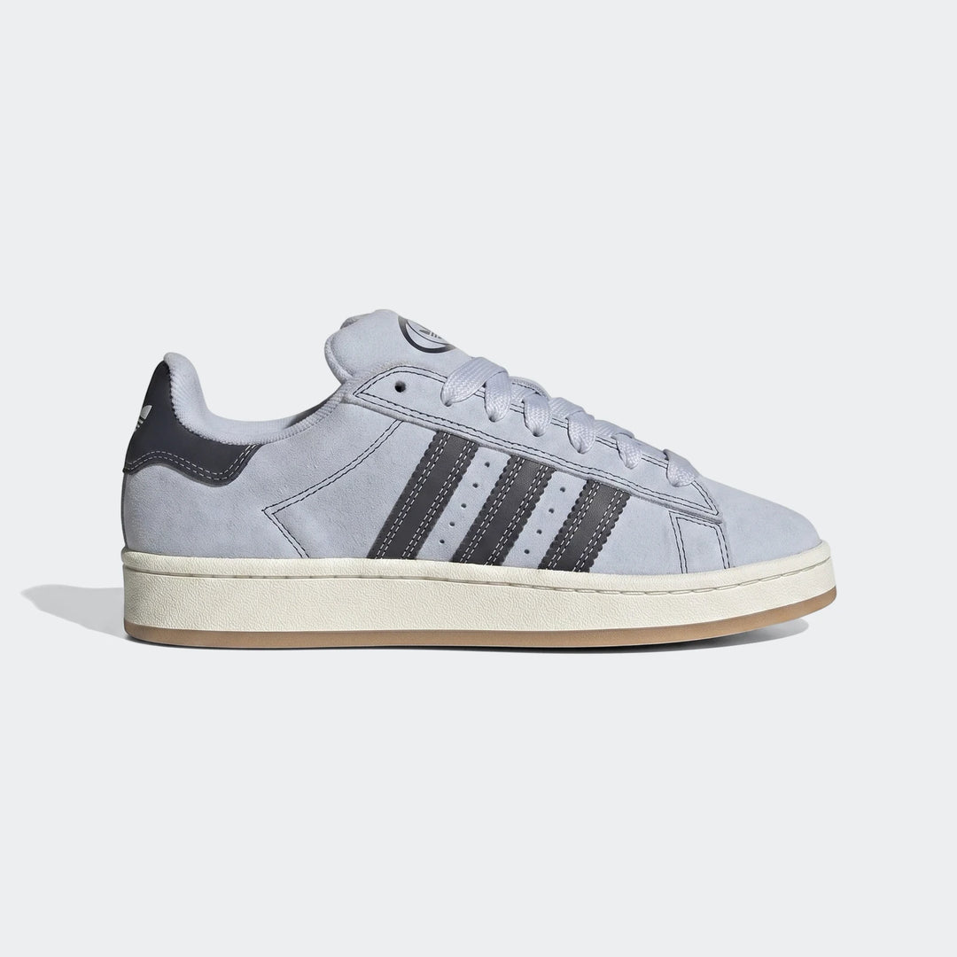 Light grey Adidas Campus 00S suede shoes with black three stripes and white laces, shown from a side view.