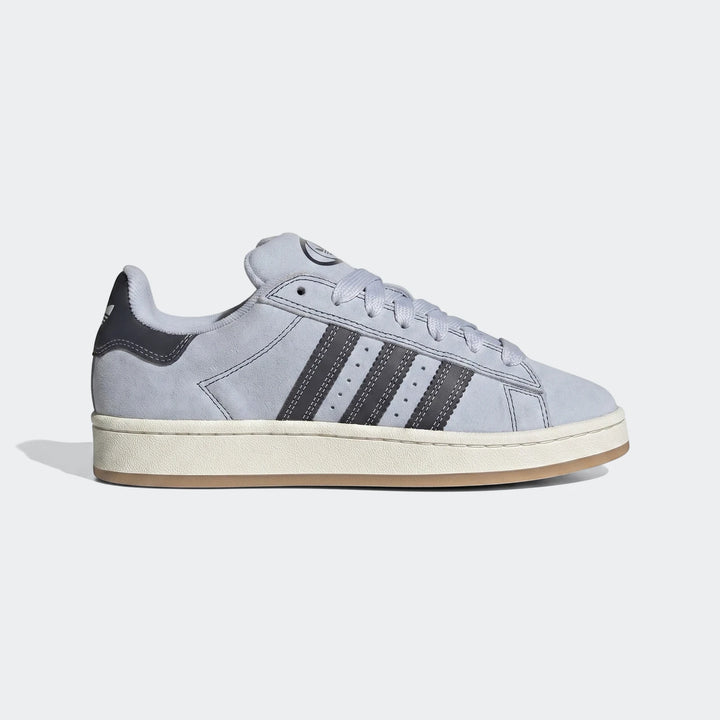 Light grey Adidas Campus 00S suede shoes with black three stripes and white laces, shown from a side view.