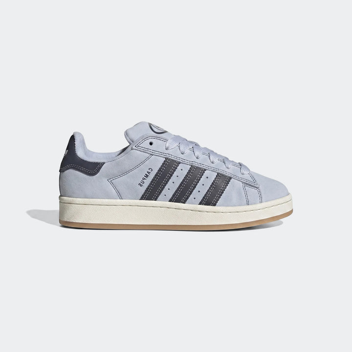Light blue suede Adidas Campus sneaker with dark grey stripes and an off-white midsole, shown in a side profile view.