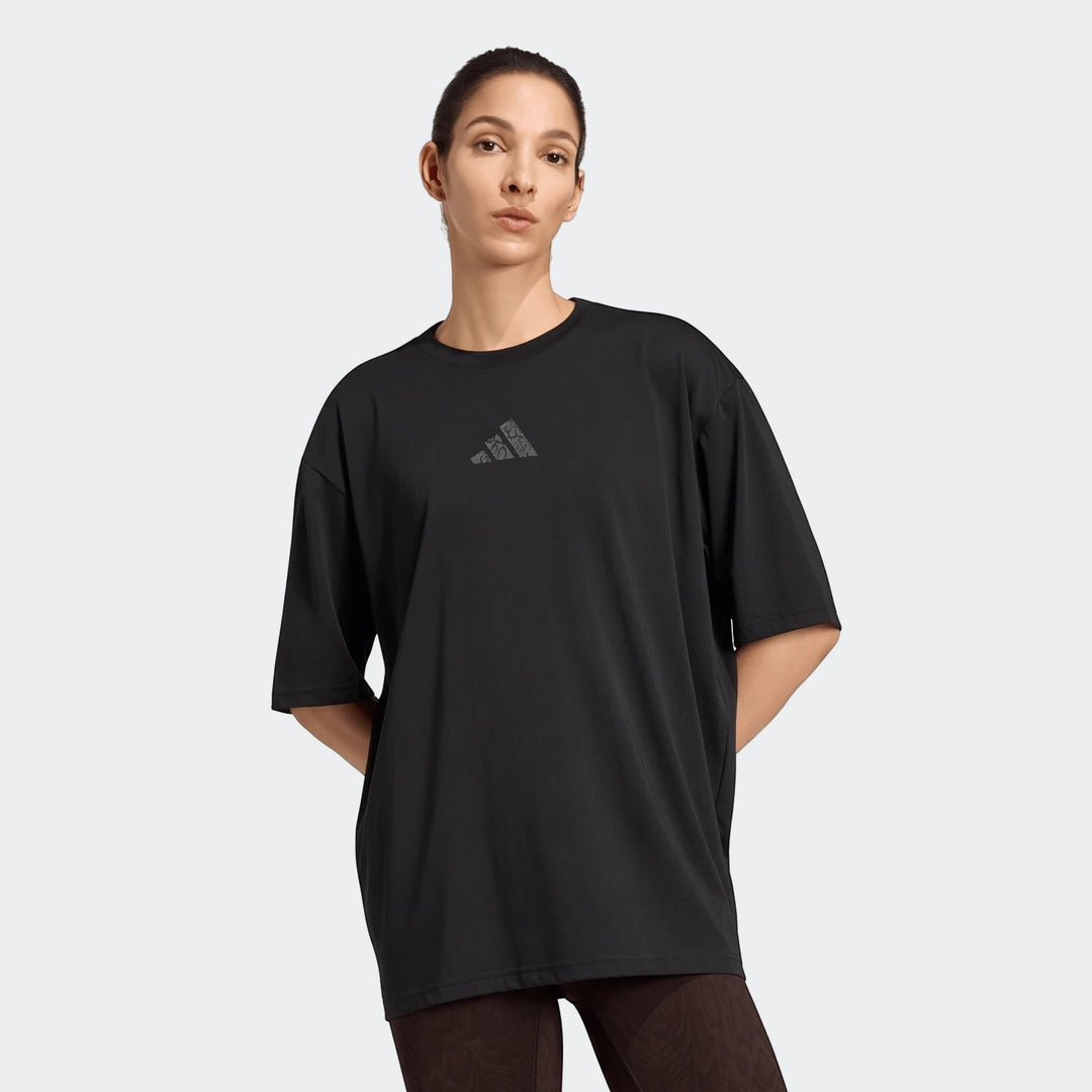 Black adidas Climacool Animal Training Graphic T-Shirt on a female model. Features a loose fit, short sleeves, and a subtle