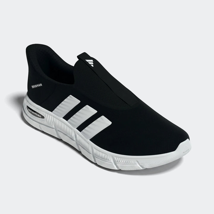 A black and white pair of Adidas Cloudfoam Flex Lounge Rapidaflow slip-on athletic shoes, featuring a black knit upper with