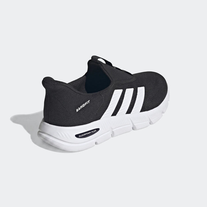Black Adidas Cloudfoam Flex Lounge Rapidaflow slip-on athletic shoes with white stripes.