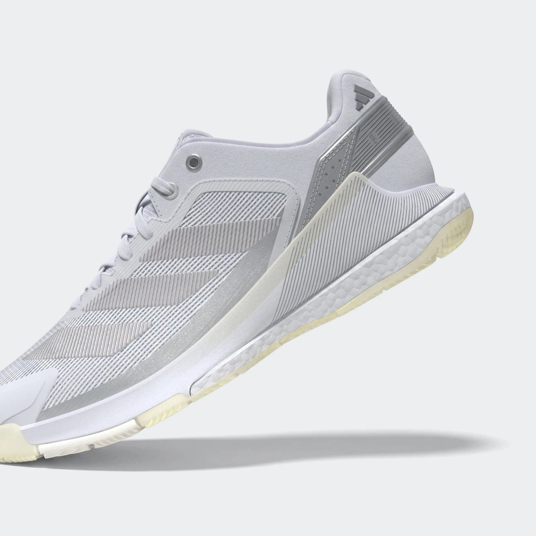 Light gray and white Adidas Crazyquick Boost Padel Shoes, athletic sneaker design with visible boost sole technology.
