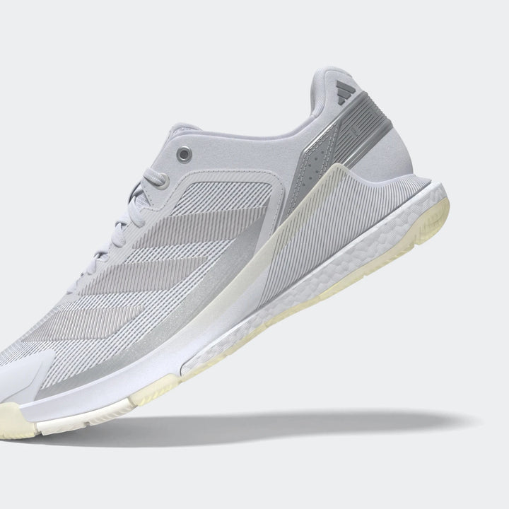 Light gray and white Adidas Crazyquick Boost Padel Shoes, athletic sneaker design with visible boost sole technology.