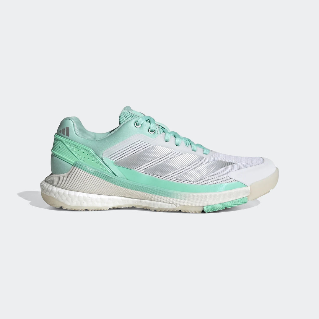 Side view of Adidas Crazyquick Boost Padel Shoes in mint green and white, featuring mesh upper and Boost cushioning.