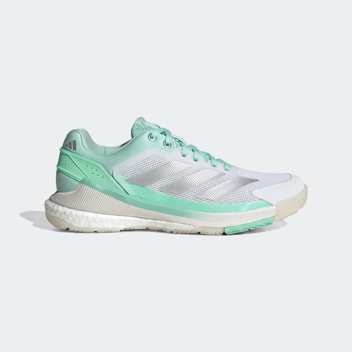 Side view of Adidas Crazyquick Boost Padel Shoes in mint green and white, featuring mesh upper and Boost cushioning.