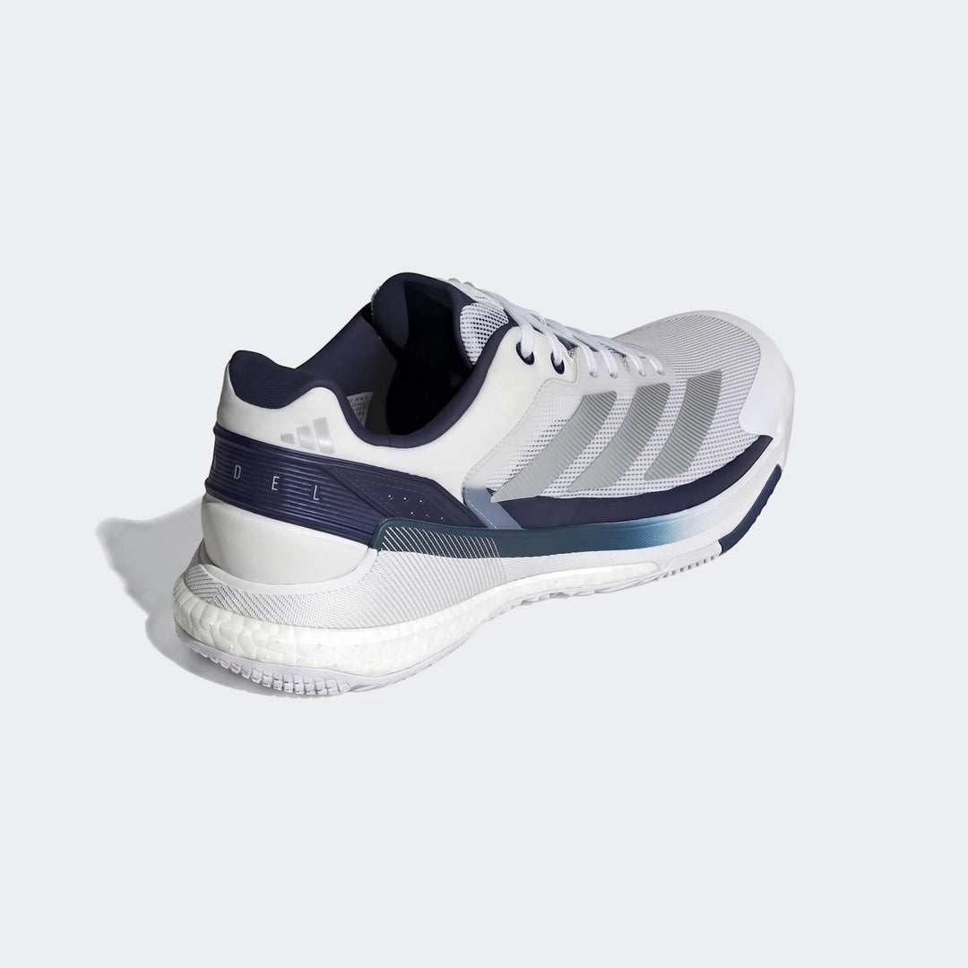 Adidas Crazyquick Boost Padel Shoes in white, navy blue, and grey, shown from a rear three-quarter view, highlighting the
