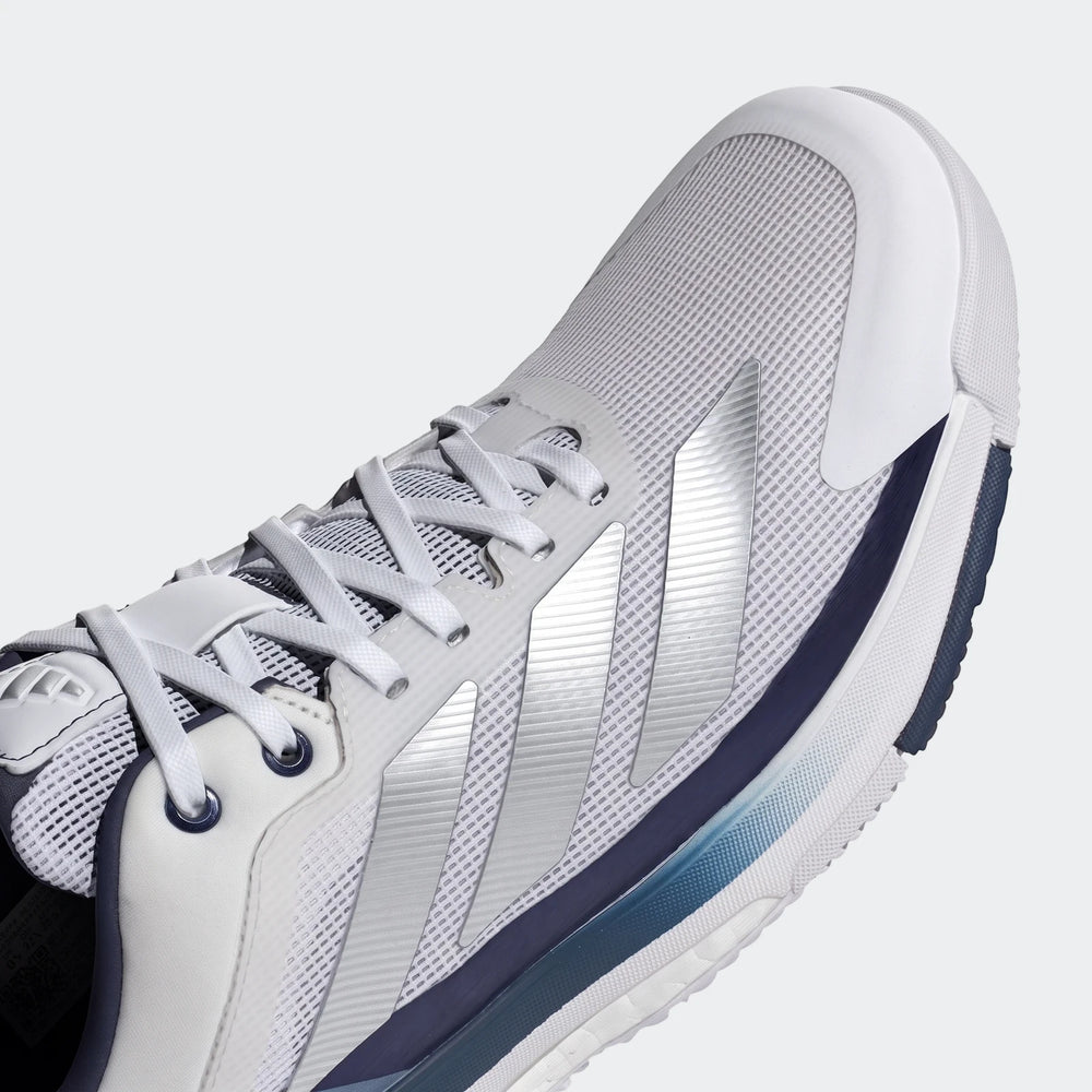 Close-up angled view of a white, silver, and navy Adidas Crazyquick Boost Padel Shoe, showcasing its mesh upper and striped