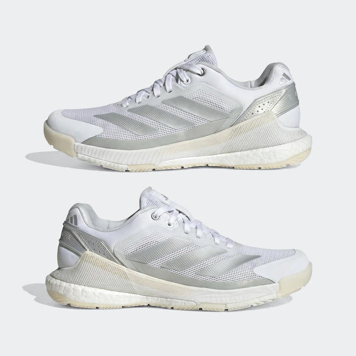 Two white and silver Adidas Crazyquick Boost Padel Shoes, designed for performance, shown from a side view.
