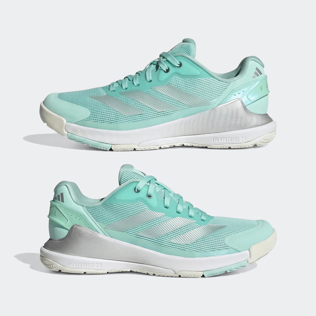 Pair of mint green and silver Adidas Crazyquick Lightstrike Padel Shoes, shown from slightly different side angles on a