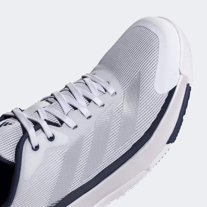 Close-up view of the light grey and navy blue Adidas Crazyquick Padel Shoe, showcasing the mesh upper, white laces, and toe