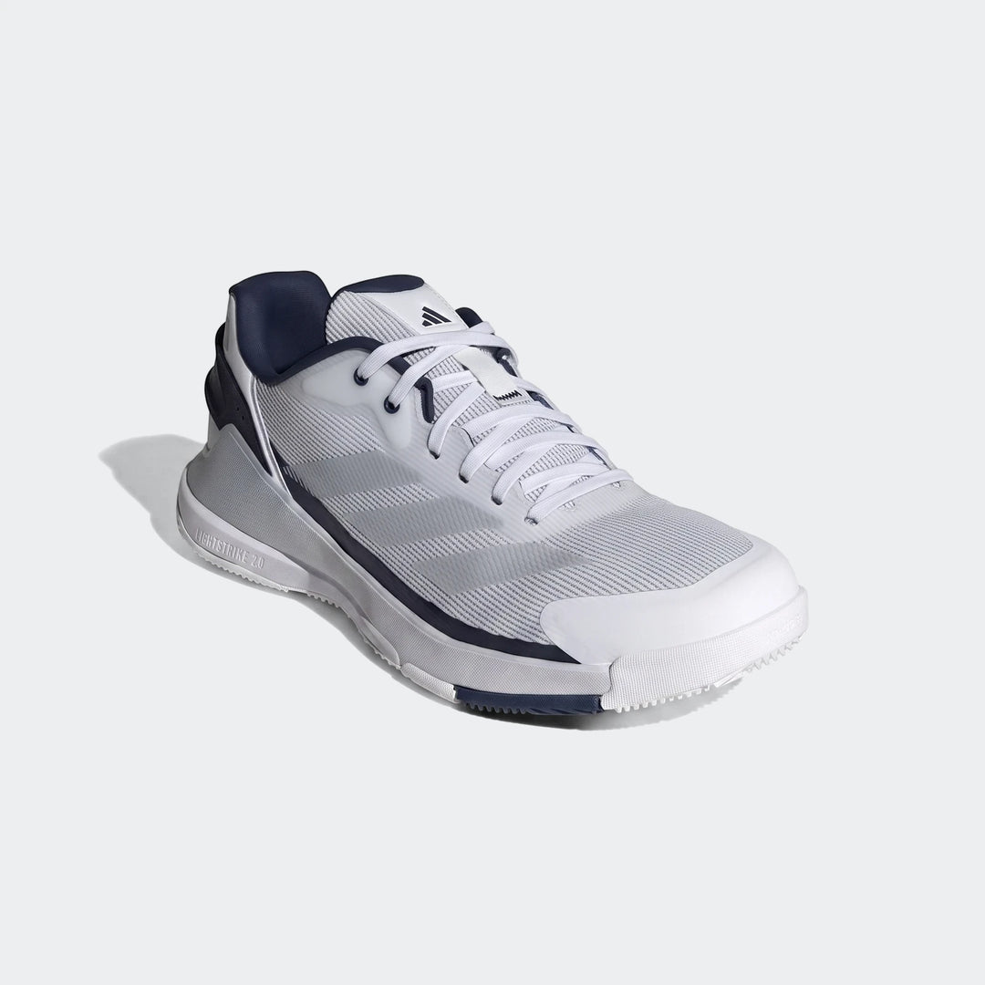 Side view of white, grey, and navy Adidas Crazyquick Padel Shoes with mesh upper and synthetic overlays.