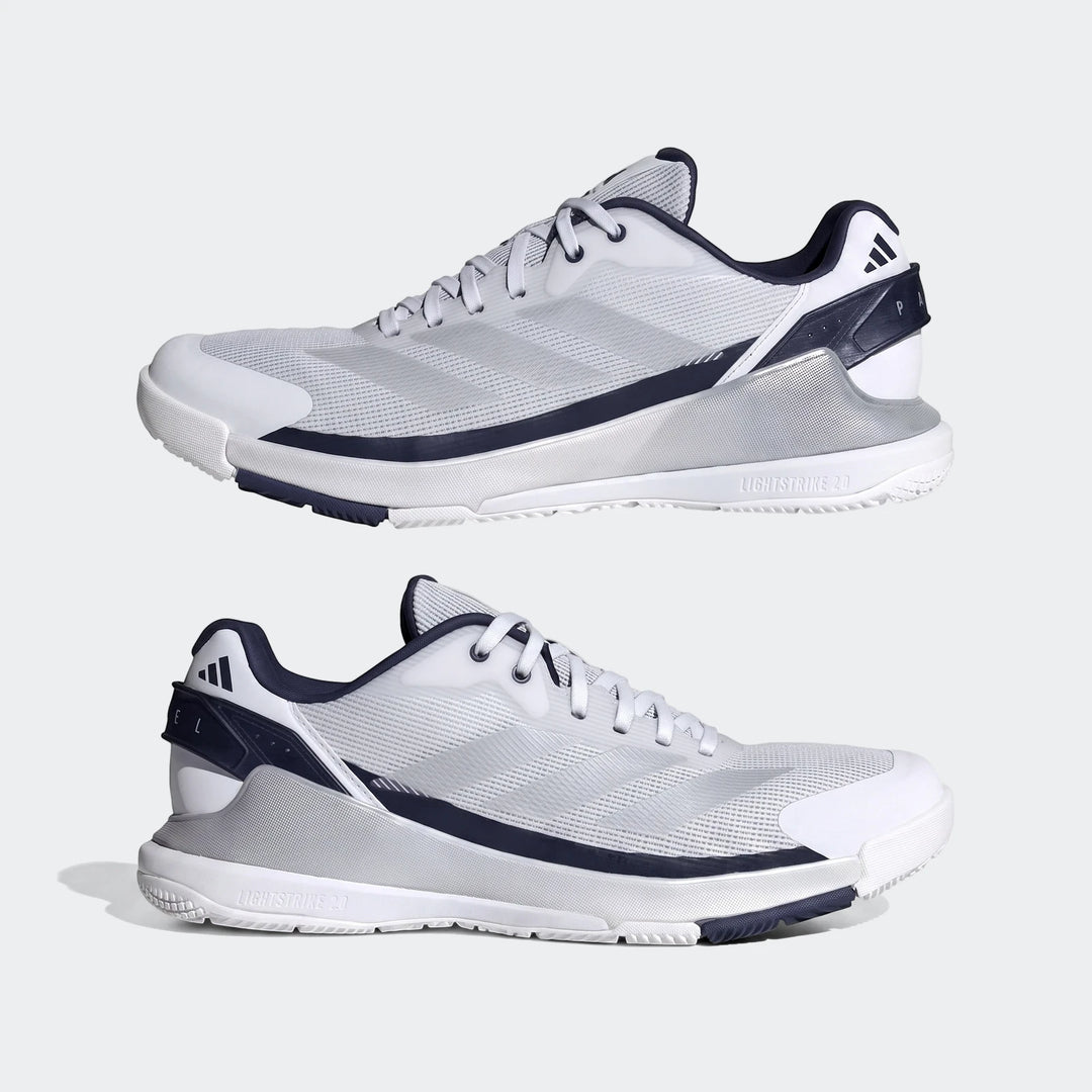 Pair of white and navy Adidas Crazyquick Padel Shoes, featuring a breathable mesh upper and durable sole for optimal court