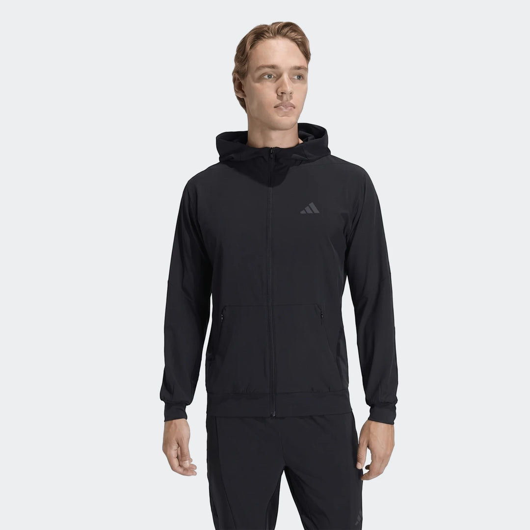 Black Adidas D4T Hybrid Full-Zip Hoodie for men, shown on a male model from the front, featuring zippered pockets.