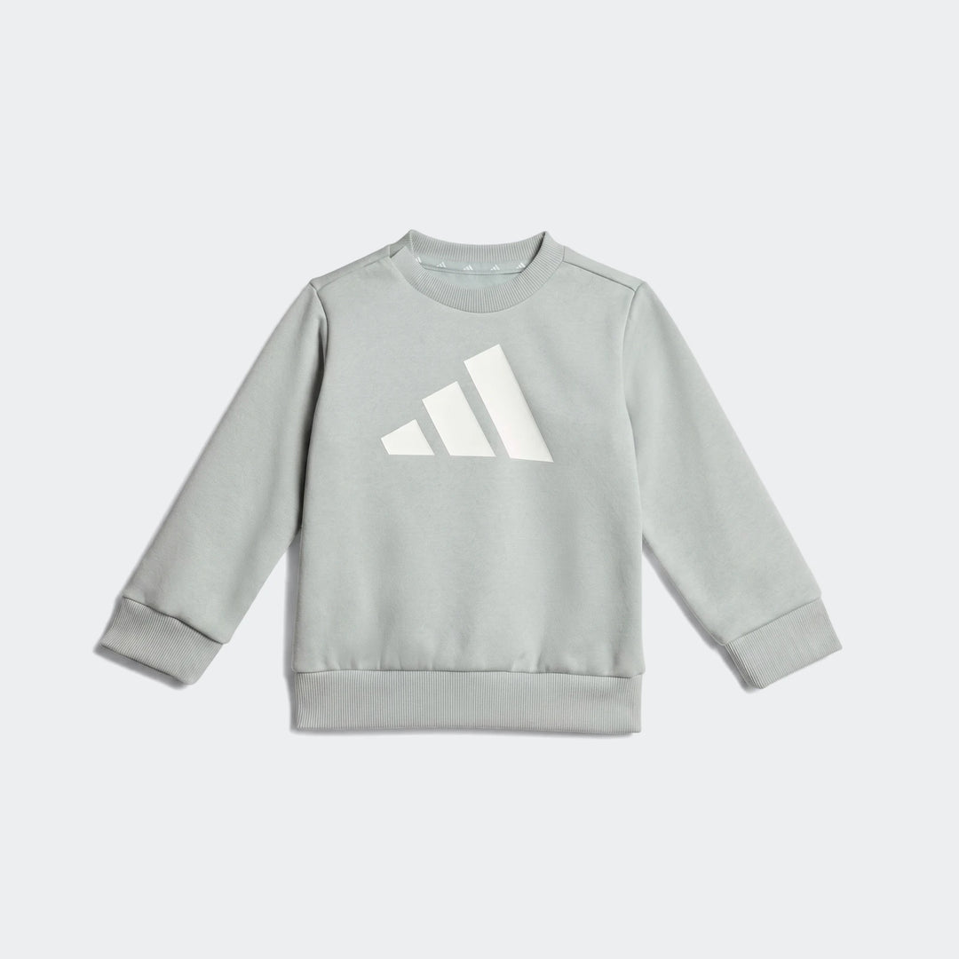 Light green Adidas Essentials Joggers Kids sweatshirt with a large white logo, flat lay view.