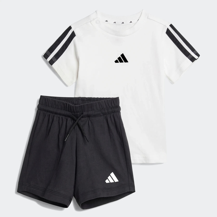 Adidas Essentials Kids Tee Set with a white short-sleeve t-shirt with black stripes and matching black shorts.