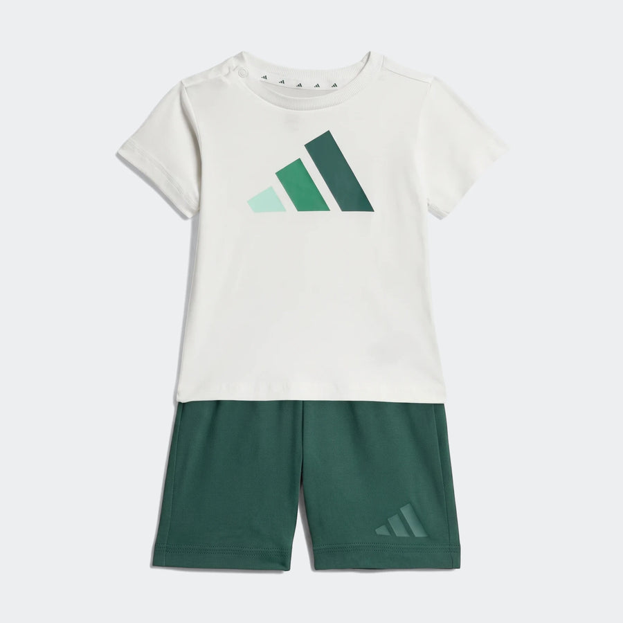 Adidas Kids Essentials Tee Set featuring a white short-sleeve t-shirt with a multi-green logo and dark green shorts.