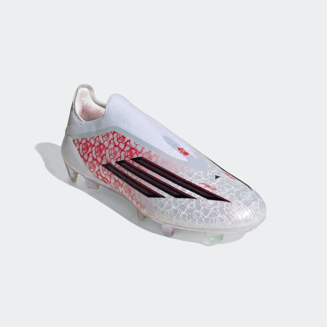 White and red Adidas F50 Elite Ll Fg Lamine Yamal football boots with rose pattern and black stripes, angled view.