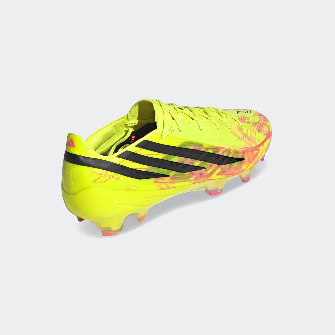 Adidas F50 Hyperfast Elite firm ground football boot in neon yellow with black stripes and pink accents, shown from a