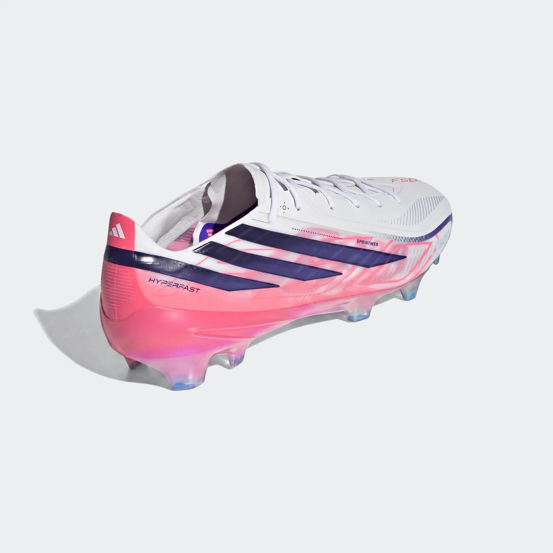 Adidas F50 Hyperfast Elite Firm Ground Football Boots in white, pink, and navy, featuring a unique stud configuration.