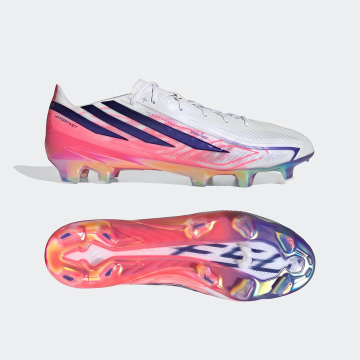 Pair of Adidas F50 Hyperfast Elite Firm Ground Football Boots in white, pink, and blue with iridescent soles, displayed side