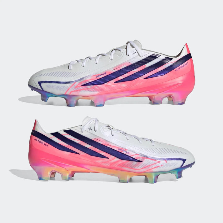 Two Adidas F50 Hyperfast Elite Firm Ground Football Boots in white with vibrant pink and purple accents, displayed on a