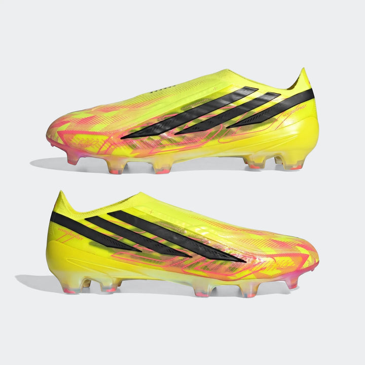 Two bright yellow and pink Adidas F50 Hyperfast Elite Laceless Firm Ground Boots in a side view, showcasing the laceless
