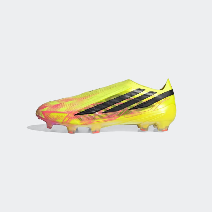 Adidas F50 Hyperfast Elite Laceless Firm Ground Boots in bright yellow and pink with black three-stripes, shown in a side