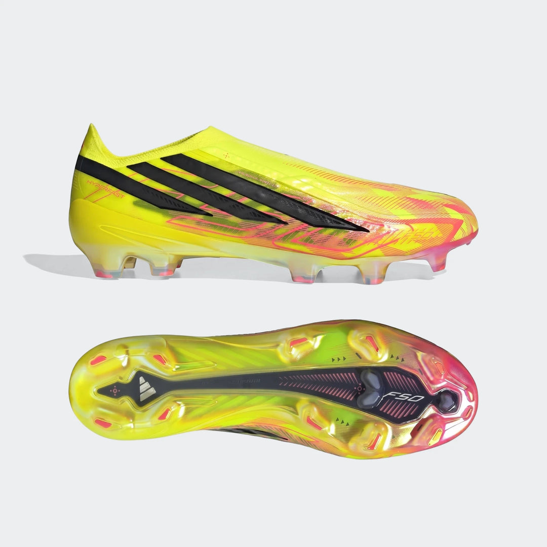 A pair of Adidas F50 Hyperfast Elite Laceless Firm Ground Boots in vibrant yellow and pink, one boot shown upright and the
