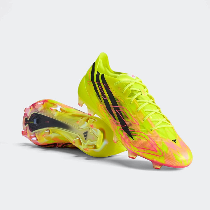 Pair of neon yellow-green and pink Adidas F50 Hyperfast Evo Firm Ground Football Boots with black stripes, side view.