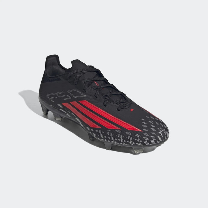 Black and red Adidas F50 Pro Firm Ground Football Boots with synthetic upper and studded sole, angled view for firm ground.